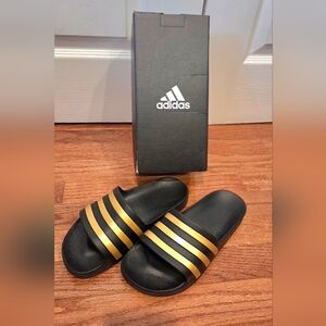 Adidas Black Slides with Gold Stripes